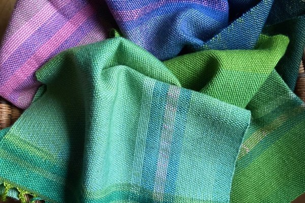 green and purple knitted scarf
